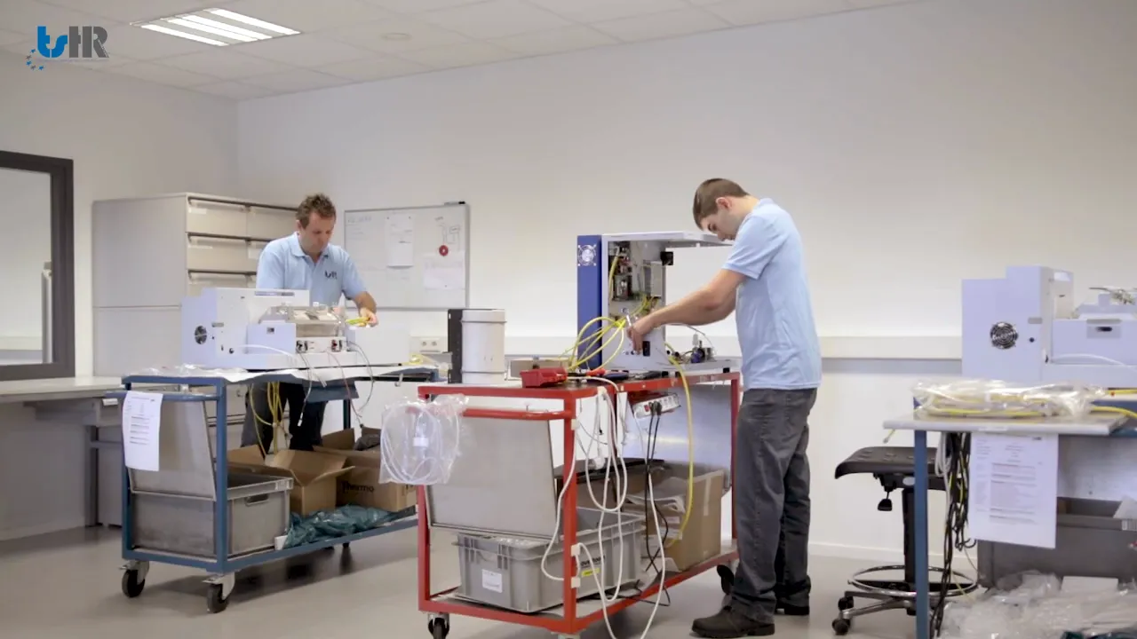 Technicians working on machines.