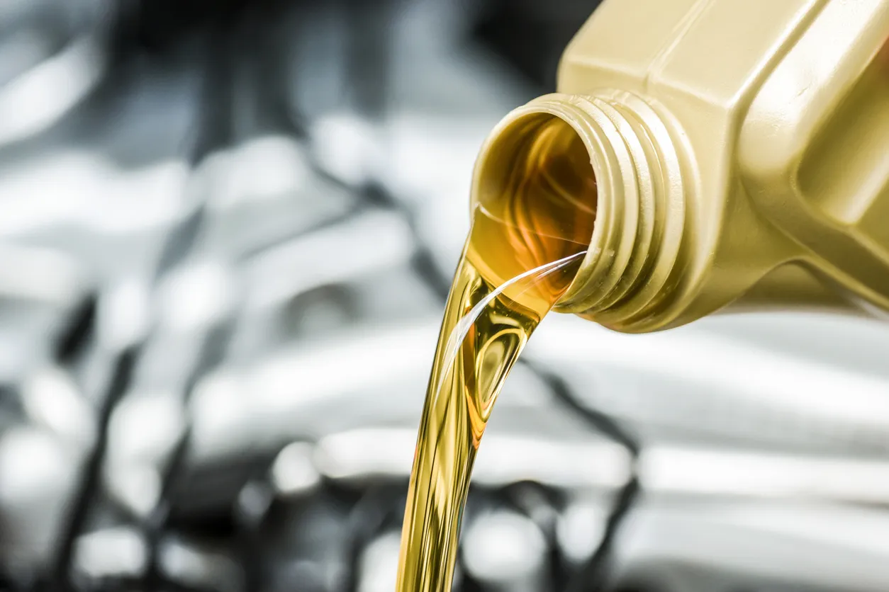 Motor oil being poured from bottle.
